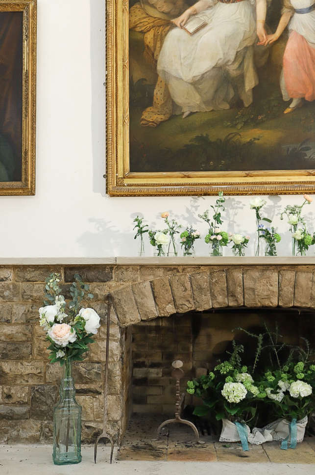 Flowers on top of fireplace
